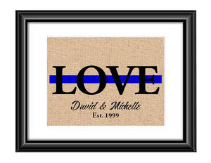 Showcase your love with this Personalized Police Thin Blue Line Love Print. This particular print has the word LOVE in large capital letters with a green line through the middle and underneath it is personalized with the couples first names and established date.  Police Love Thin Blue Line Personalized Burlap or Cotton Print